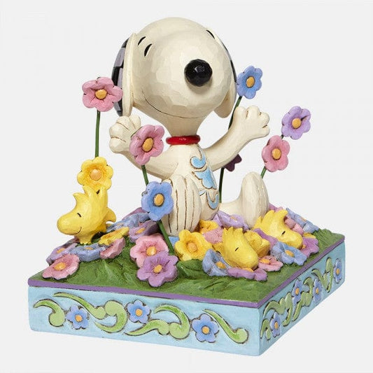 Snoopy in bed of Flowers Figurine By Jim Shore