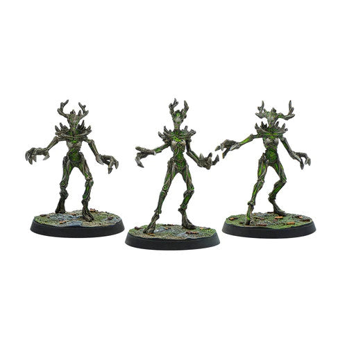 Three painted The Elder Scrolls Call To Arms Spriggans miniatures by Modiphius stand on round bases against a white background.