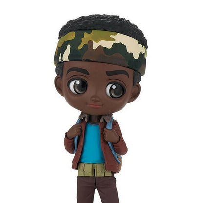 The Banpresto Lucas Q Posket Stranger Things vinyl figure by Bandai Namco features dark skin, large eyes, curly hair, a green camo headband, blue shirt, brown jacket and pants, plus a backpack.